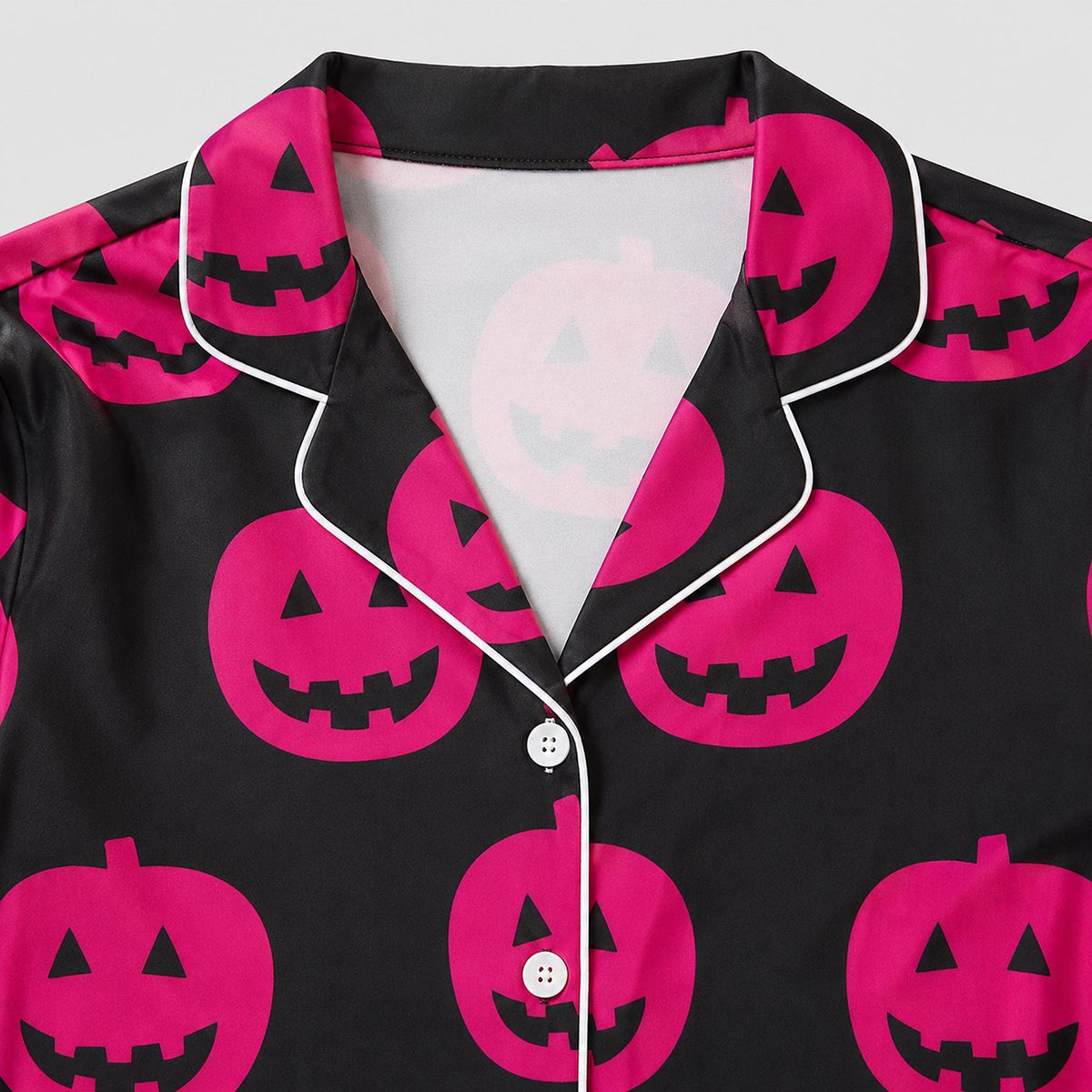 Spooky Halloween Sleepwear: Black & Hot Pink Pumpkin Satin Pajama Set with Jack O Lantern Pattern